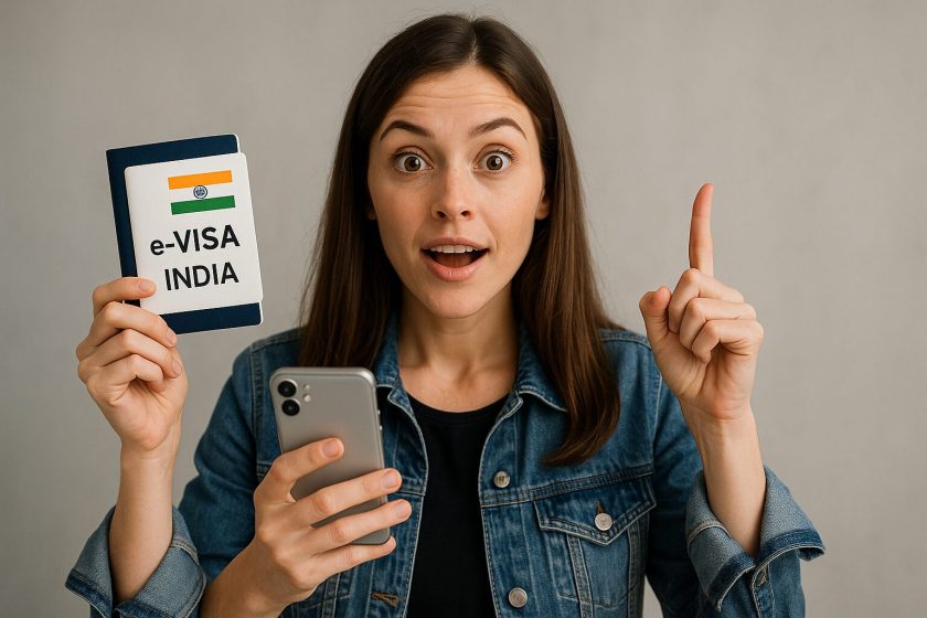 Excited female tourist holding a phone and passport with an 'e-VISA INDIA' label, pointing upward as if sharing important travel information.
